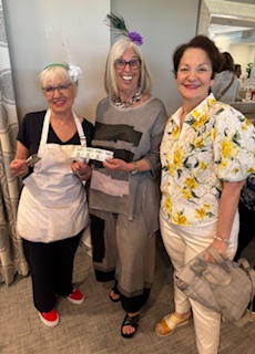 (Left to Right) Francesca Carbone, Bobbi Wittenburg, and Patti Garrison have a good time selling chances for the raffles