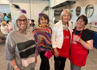 (Left to Right) Bobbi Wittenburg, Barbara Shuster, Mary O’Neil, and Paula Wissmann take a break from working the room