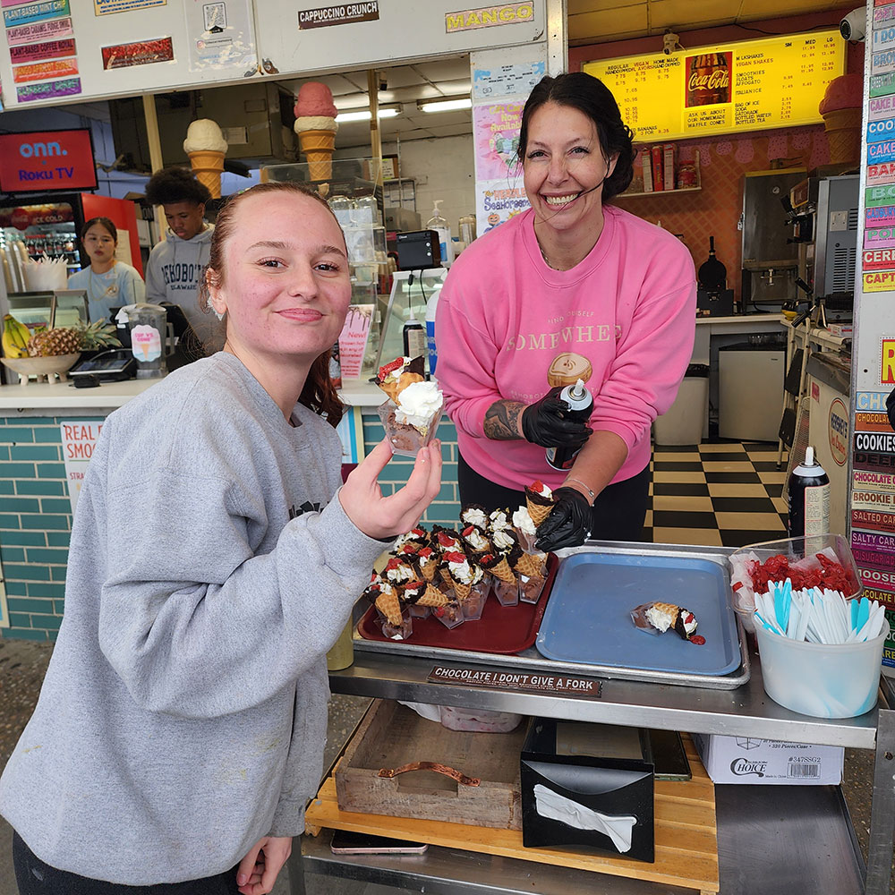 This year, Bella (in gray) at The Ice Cream Store devised a sundae with I Don’t Give a Fork chocolate ice cream, a house made waffle cone dipped in chocolate, and garnished the treat with whipped cream, pistachio sauce, and a strawberry.