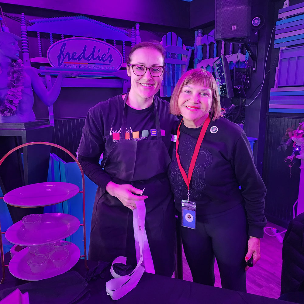 Cathy Daines-Haron and Tina Gregg serve a Bailey’s and Chocolate Razzmatazz whipped creation at Freddie’s Beach Bar, which served as the base for La-Di-Da’s brownie.